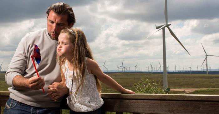 Photo of a father and daughter at Whitelee windfarm